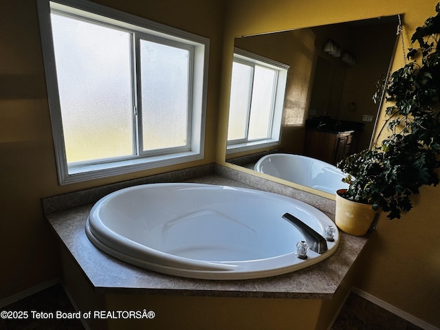 27 Chief Joseph, Daniel, WY 83115 - bathroom featuring a bath and baseboards
