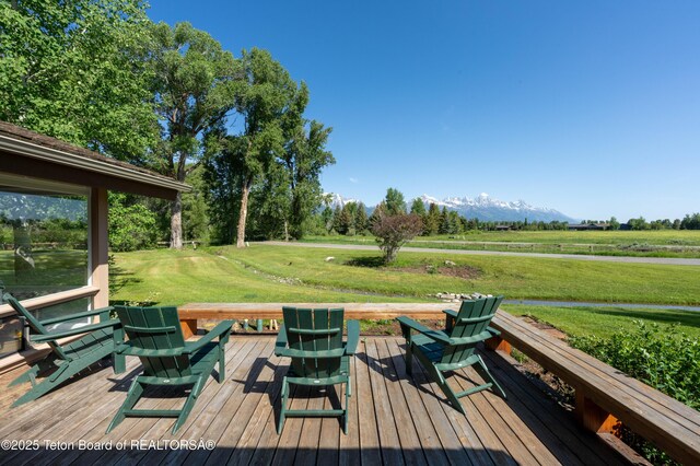 525 E Golf Creek Ln Unit 34, Jackson, WY 83001 - wooden terrace featuring a lawn and a mountain view