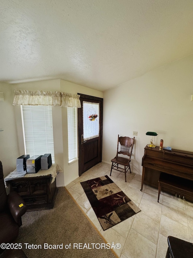 144 Blue Lake Cir, Alpine, WY 83128 - foyer entrance with a textured ceiling and light tile patterned floors