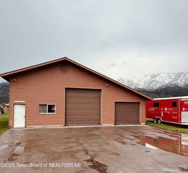 144 Blue Lake Cir, Alpine, WY 83128 - garage featuring a mountain view