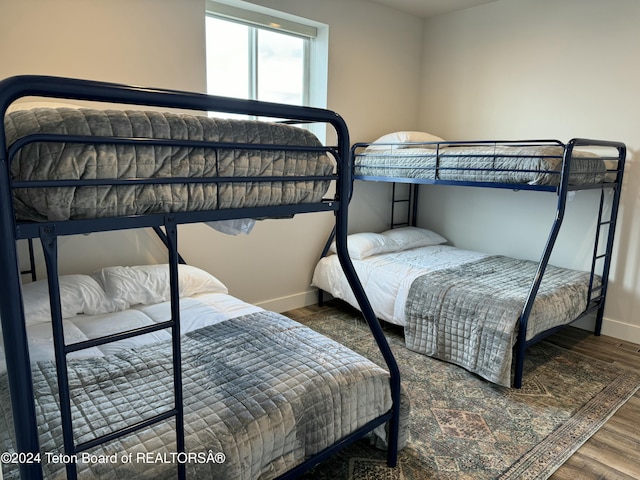 241 Cedar Creek Dr, Star Valley Ranch, WY 83127 - bedroom featuring baseboards and wood finished floors