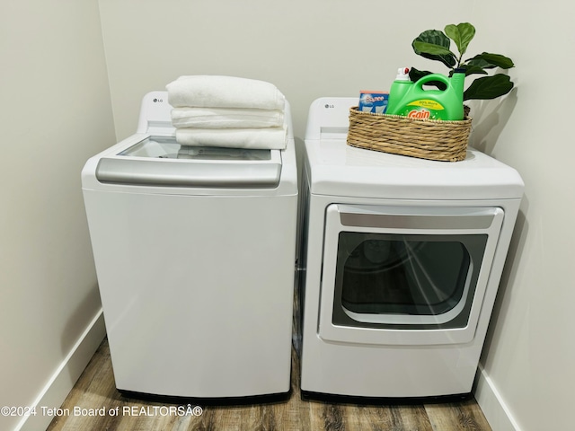 241 Cedar Creek Dr, Star Valley Ranch, WY 83127 - laundry area featuring independent washer and dryer and dark wood-type flooring
