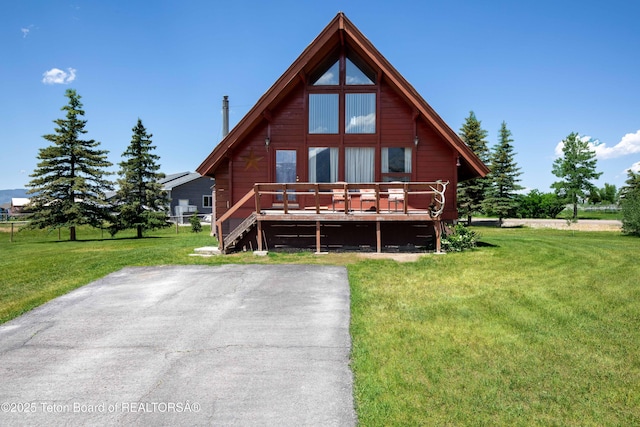 11 E St, Star Valley Ranch, WY 83127 - view of front of property with a wooden deck and a front lawn