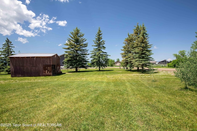 11 E St, Star Valley Ranch, WY 83127 - view of green lawn with an outbuilding