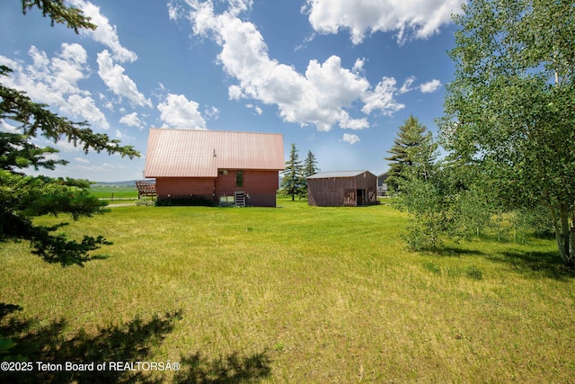 11 E St, Star Valley Ranch, WY 83127 - view of grassy yard featuring an outbuilding and an outdoor structure