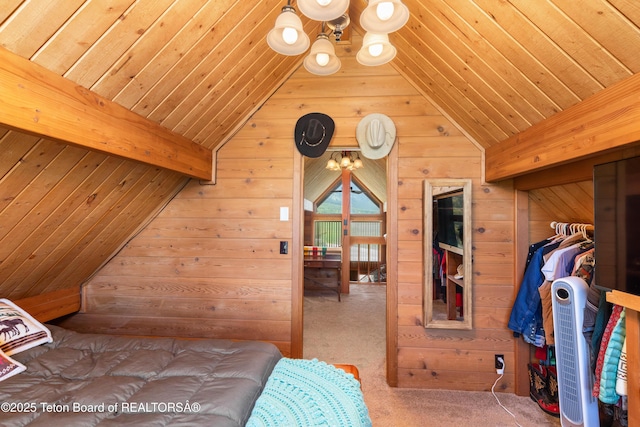 11 E St, Star Valley Ranch, WY 83127 - bedroom with wood walls, wooden ceiling, a chandelier, and carpet flooring