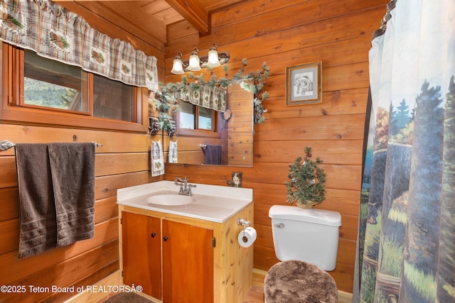 11 E St, Star Valley Ranch, WY 83127 - bathroom featuring vanity, wood walls, and a wooden ceiling with exposed beams