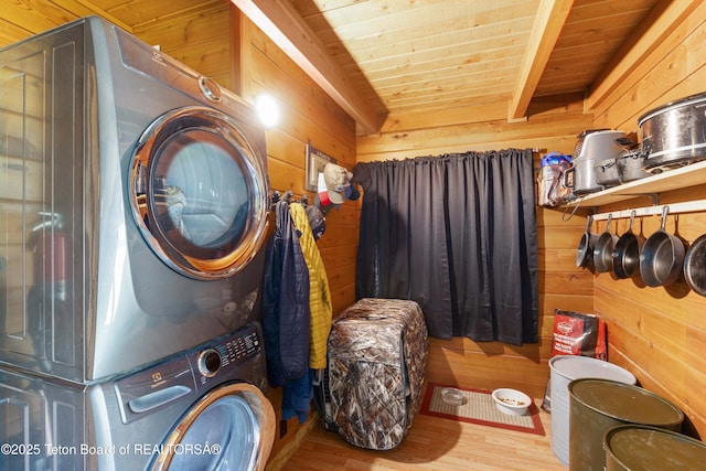 11 E St, Star Valley Ranch, WY 83127 - washroom with estacked washer and dryer, wooden ceiling, wooden walls, and wood finished floors