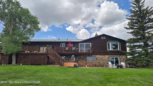 15 E Badger Trl, Pinedale, WY 82941 - back of property featuring a wooden deck, a chimney, a yard, and stairway