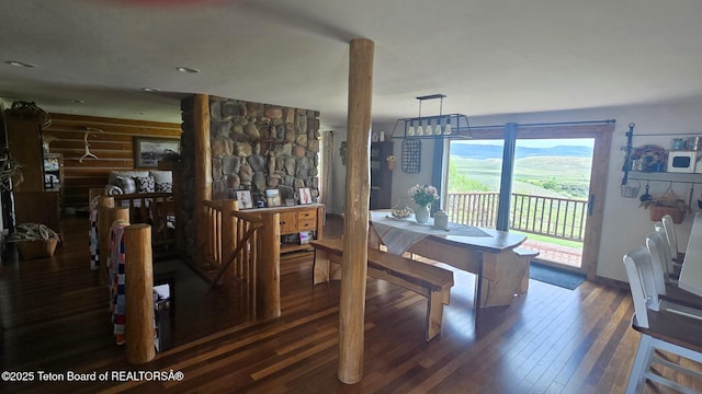 15 E Badger Trl, Pinedale, WY 82941 - dining space featuring wood-type flooring and rustic walls