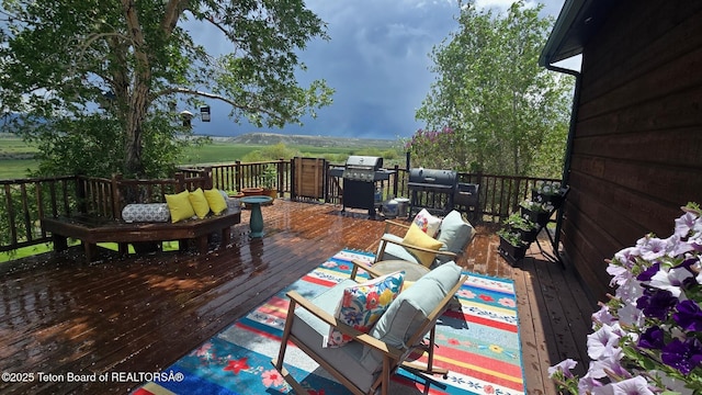 15 E Badger Trl, Pinedale, WY 82941 - wooden deck with a grill and outdoor lounge area