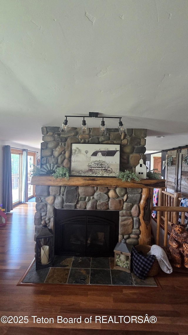 15 E Badger Trl, Pinedale, WY 82941 - detailed view of a stone fireplace and wood finished floors