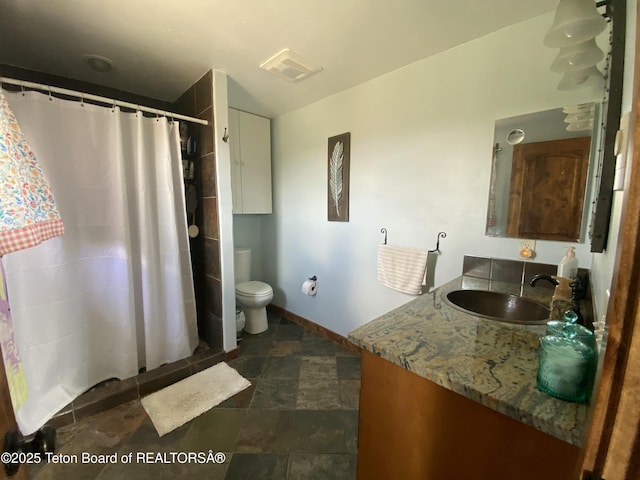 15 E Badger Trl, Pinedale, WY 82941 - bathroom featuring vanity, a shower with curtain, and stone finish flooring