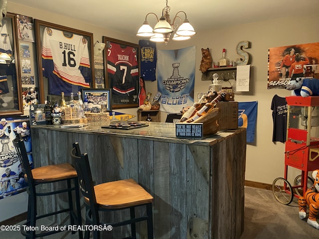 15 E Badger Trl, Pinedale, WY 82941 - indoor dry bar with carpet and a chandelier