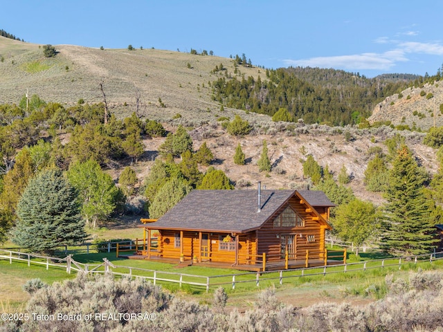 53 Schenck Ln, Dubois, WY 82513 - rear view of property featuring log exterior and a view of rural / pastoral area