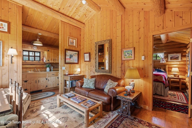 53 Schenck Ln, Dubois, WY 82513 - living room featuring wood ceiling, hardwood / wood-style floors, log walls, wood walls, and plenty of natural light