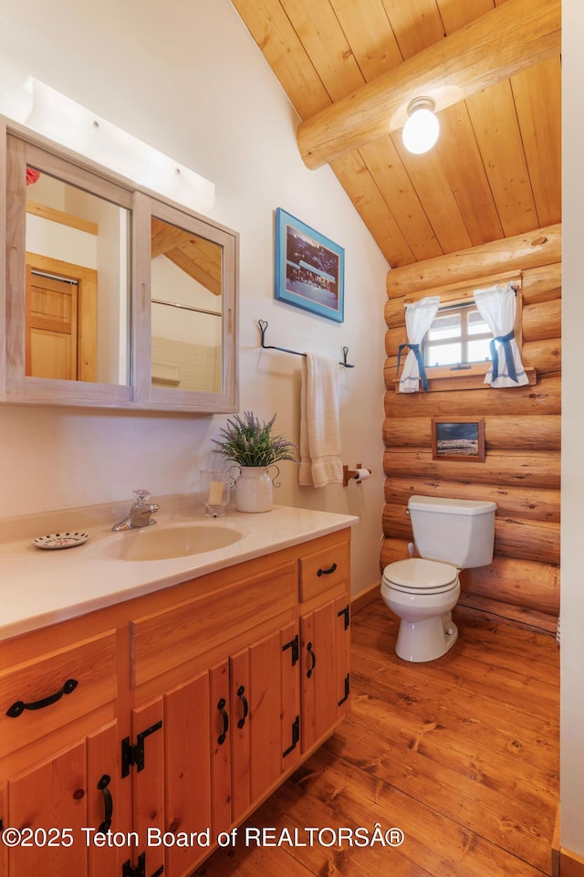 53 Schenck Ln, Dubois, WY 82513 - bathroom featuring rustic walls, wooden ceiling, vanity, and wood finished floors