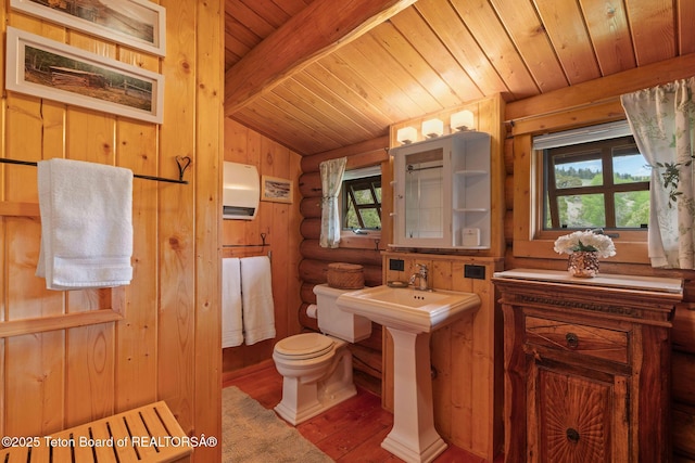53 Schenck Ln, Dubois, WY 82513 - bathroom featuring wood ceiling, plenty of natural light, wood finished floors, and log walls