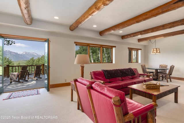 1520 N Pratt Rd, Jackson, WY 83001 - living area featuring light colored carpet, healthy amount of natural light, recessed lighting, beamed ceiling, and a mountain view