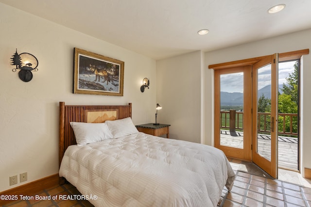 1520 N Pratt Rd, Jackson, WY 83001 - tiled bedroom with a mountain view, access to exterior, and recessed lighting