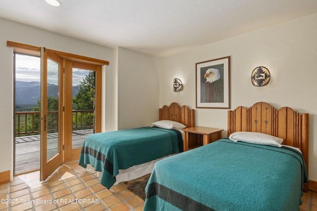 1520 N Pratt Rd, Jackson, WY 83001 - bedroom featuring access to outside, a mountain view, and light tile patterned floors