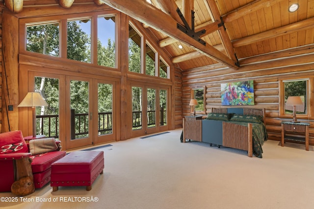 1520 N Pratt Rd, Jackson, WY 83001 - carpeted living area with high vaulted ceiling, a wood ceiling with exposed beams, and rustic walls