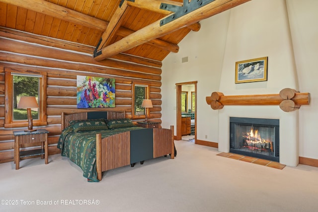 1520 N Pratt Rd, Jackson, WY 83001 - carpeted bedroom featuring a wooden ceiling with exposed beams, a large fireplace, rustic walls, and high vaulted ceiling