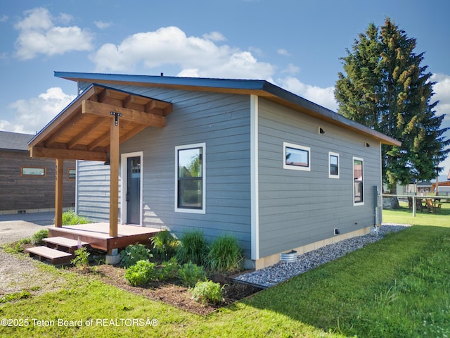 436 E Little Ave, Driggs, ID 83422 - view of home's exterior featuring a wooden deck, a yard, and crawl space