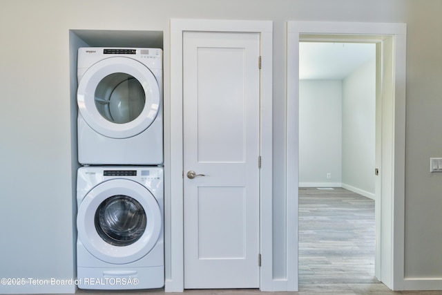 436 E Little Ave, Driggs, ID 83422 - laundry room featuring stacked washer / drying machine and wood finished floors