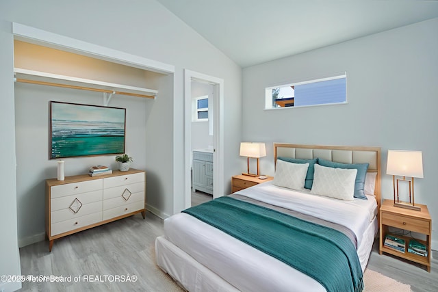 436 E Little Ave, Driggs, ID 83422 - bedroom with wood finished floors, lofted ceiling, and connected bathroom
