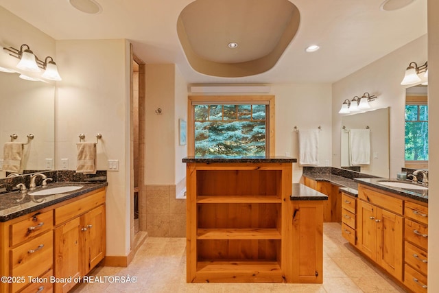 445 Aspen Ridge Trl, Alpine, WY 83128 - bathroom featuring tile patterned flooring, two vanities, a shower stall, and recessed lighting