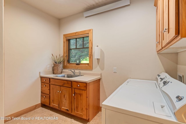 445 Aspen Ridge Trl, Alpine, WY 83128 - washroom with cabinet space, washing machine and dryer, and light tile patterned floors