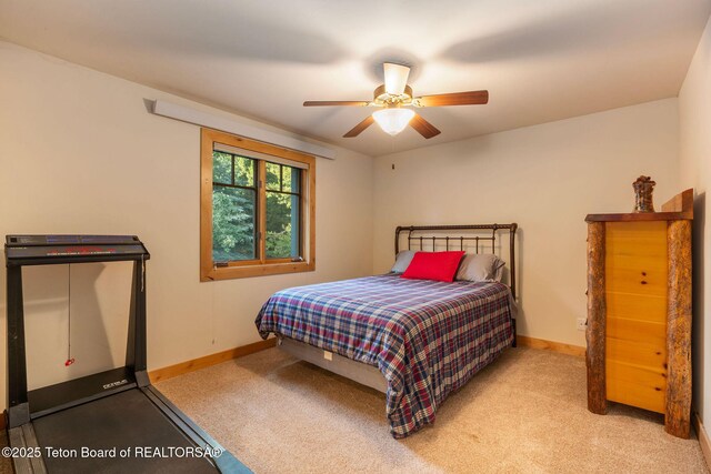 445 Aspen Ridge Trl, Alpine, WY 83128 - bedroom featuring carpet and a ceiling fan