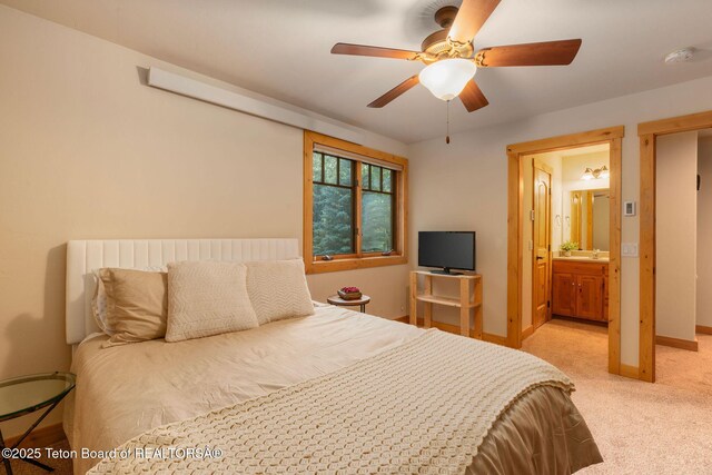 445 Aspen Ridge Trl, Alpine, WY 83128 - carpeted bedroom featuring ensuite bath and ceiling fan