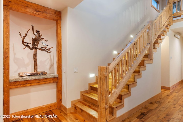 445 Aspen Ridge Trl, Alpine, WY 83128 - staircase featuring hardwood / wood-style floors and baseboards