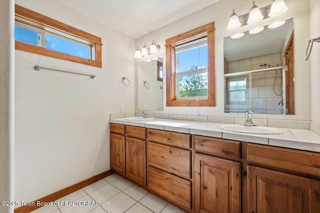 172 Brome Dr, Victor, ID 83455 - full bath featuring double vanity, a shower stall, and tile patterned floors