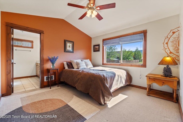 172 Brome Dr, Victor, ID 83455 - bedroom with vaulted ceiling, light carpet, a ceiling fan, and ensuite bath