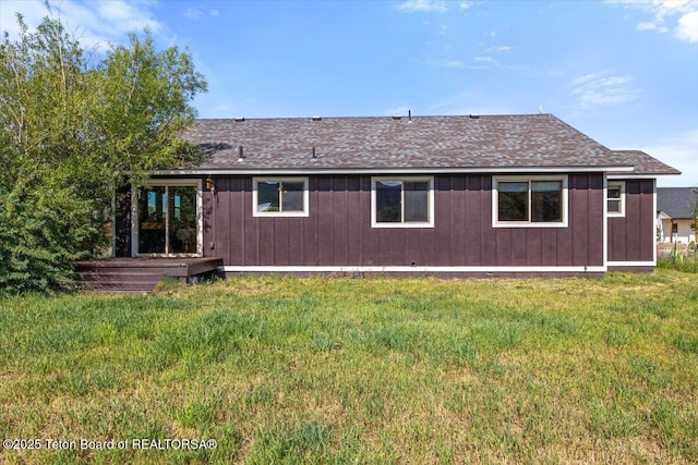 172 Brome Dr, Victor, ID 83455 - rear view of property with a yard, roof with shingles, and a wooden deck
