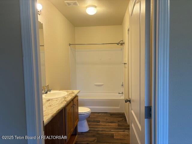47 Jackalope Dr, Irwin, ID 83428 - bathroom featuring vanity, wood finished floors, and shower / washtub combination