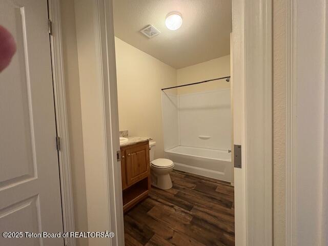 47 Jackalope Dr, Irwin, ID 83428 - bathroom featuring wood finished floors, vanity, and  shower combination