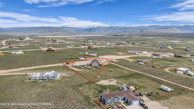 25 Neosha Trl, Boulder, WY 82923 - aerial view of property and surrounding area featuring a mountain backdrop and property boundaries highlighted