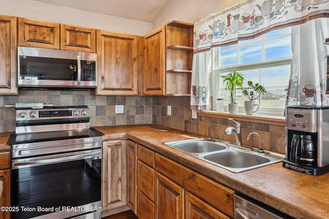25 Neosha Trl, Boulder, WY 82923 - kitchen featuring stainless steel appliances, backsplash, brown cabinets, and open shelves