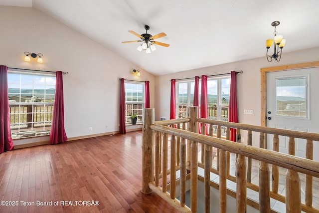 25 Neosha Trl, Boulder, WY 82923 - corridor with an upstairs landing, vaulted ceiling, wood finished floors, and a chandelier