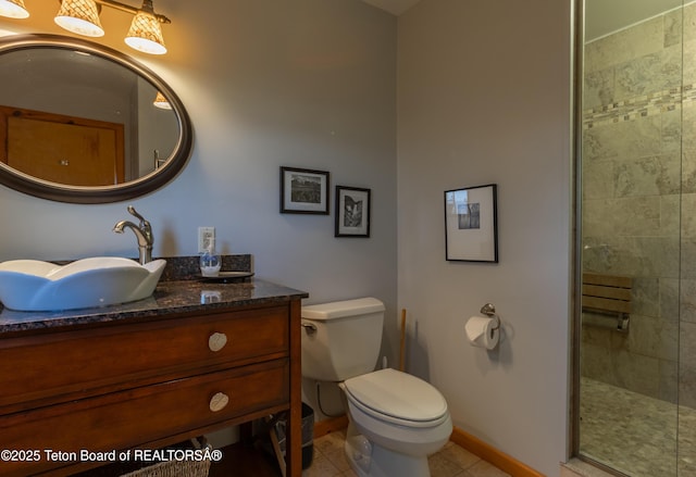 3953 Adams Rd, Driggs, ID 83422 - full bathroom with vanity, a stall shower, and tile patterned floors