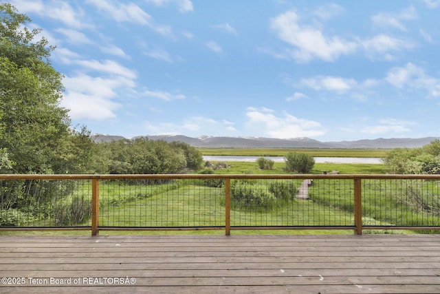 3953 Adams Rd, Driggs, ID 83422 - wooden terrace featuring a water and mountain view