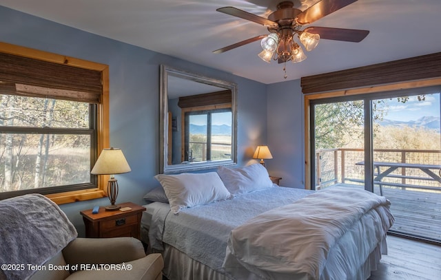 3953 Adams Rd, Driggs, ID 83422 - bedroom featuring wood finished floors, access to exterior, and ceiling fan