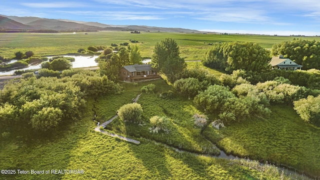 3953 Adams Rd, Driggs, ID 83422 - aerial overview of property's location with rural landscape and a mountainous background