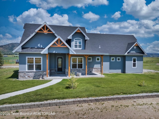 3139 Swan Valley Hwy, Swan Valley, ID 83449 - craftsman inspired home with stone siding, a shingled roof, and a front lawn
