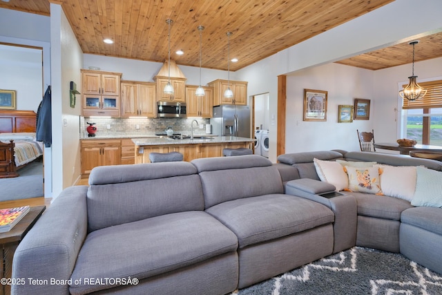 3139 Swan Valley Hwy, Swan Valley, ID 83449 - living room featuring wooden ceiling, washer / clothes dryer, a chandelier, and recessed lighting