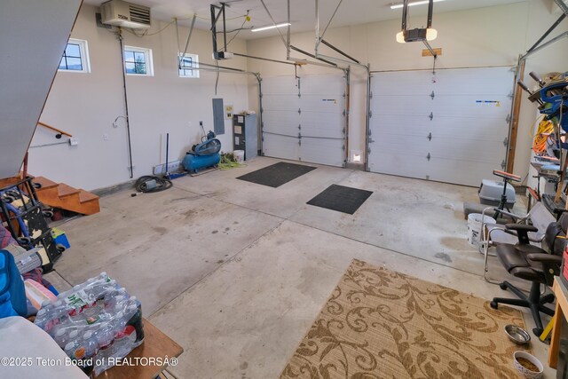 3139 Swan Valley Hwy, Swan Valley, ID 83449 - garage with a garage door opener, electric panel, and a heating unit